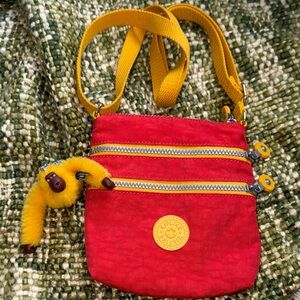 The bag is a Kipling model in a crossbody or shoulder style.